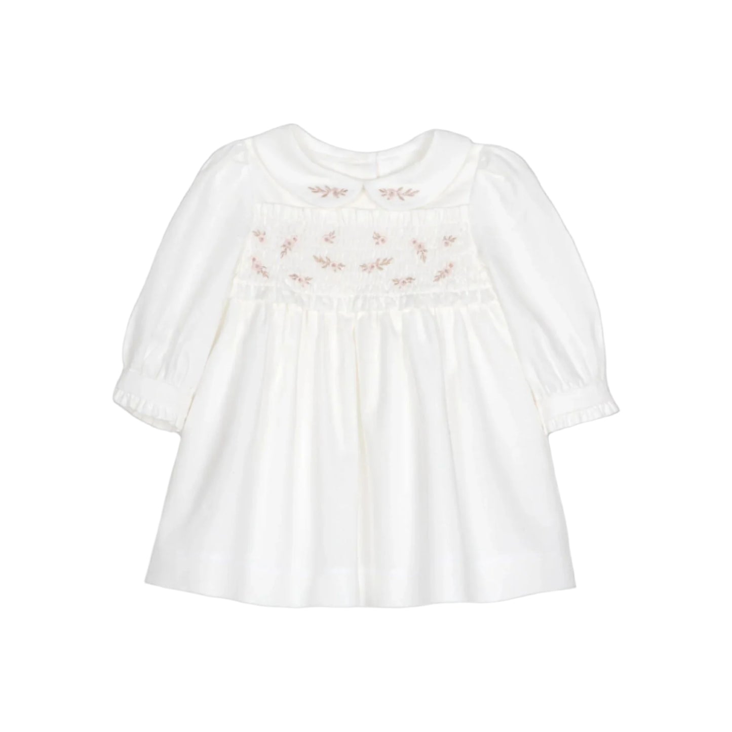 White blouse with floral embroidery on a black background