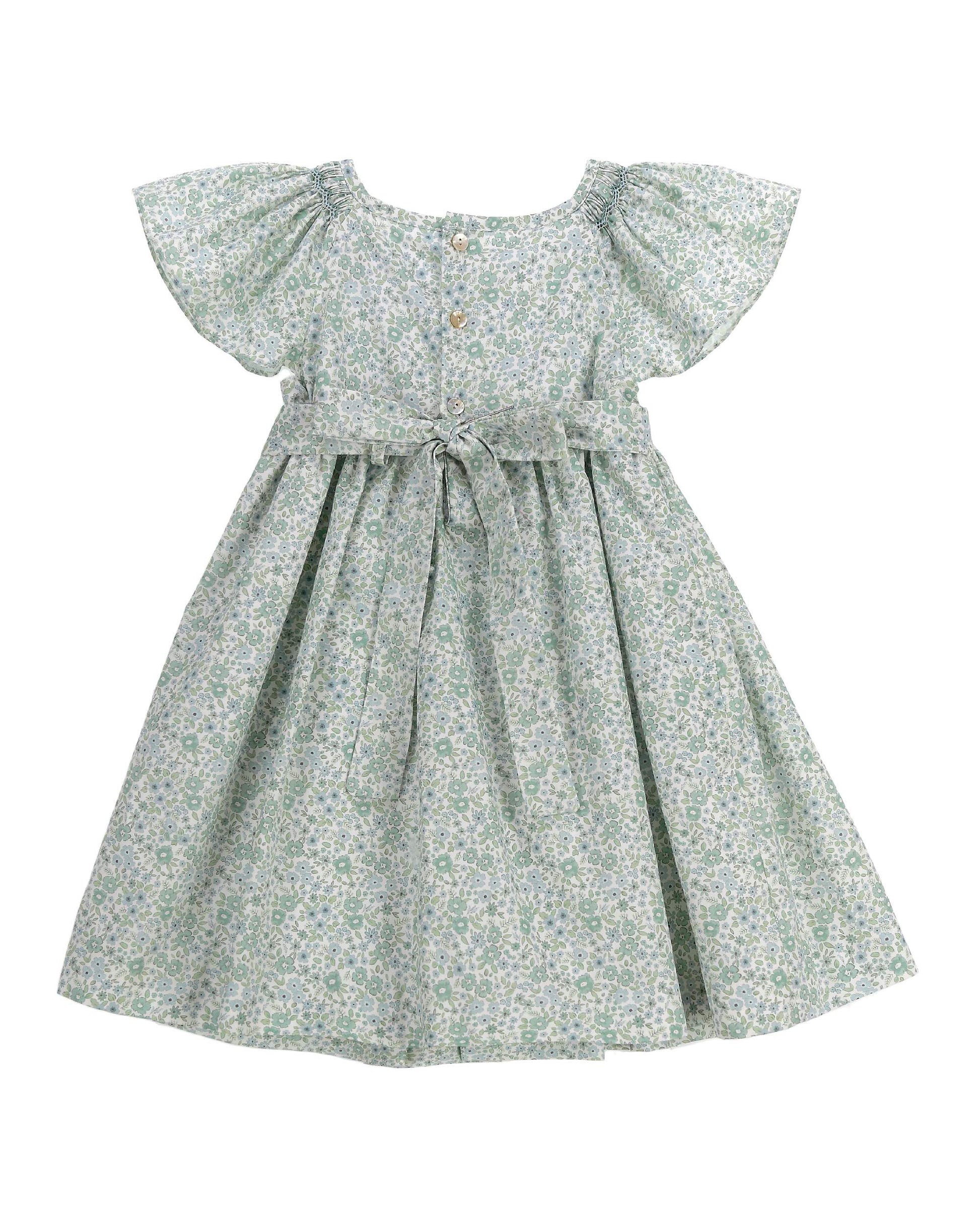 Back view of sage floral smocked dress for toddler with flutter sleeves and gathered skirt