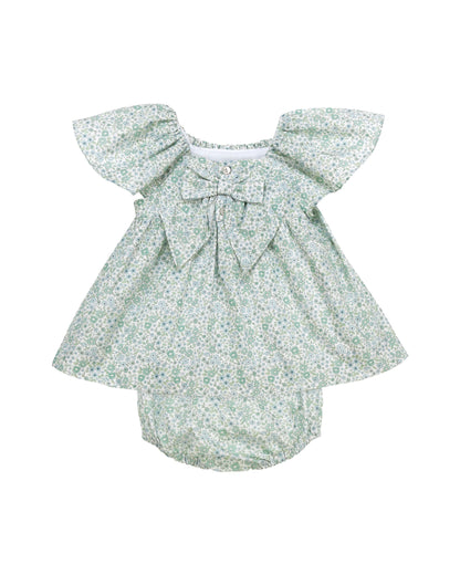 Back view of floral baby dress set with hand smocked neckline and flutter sleeves