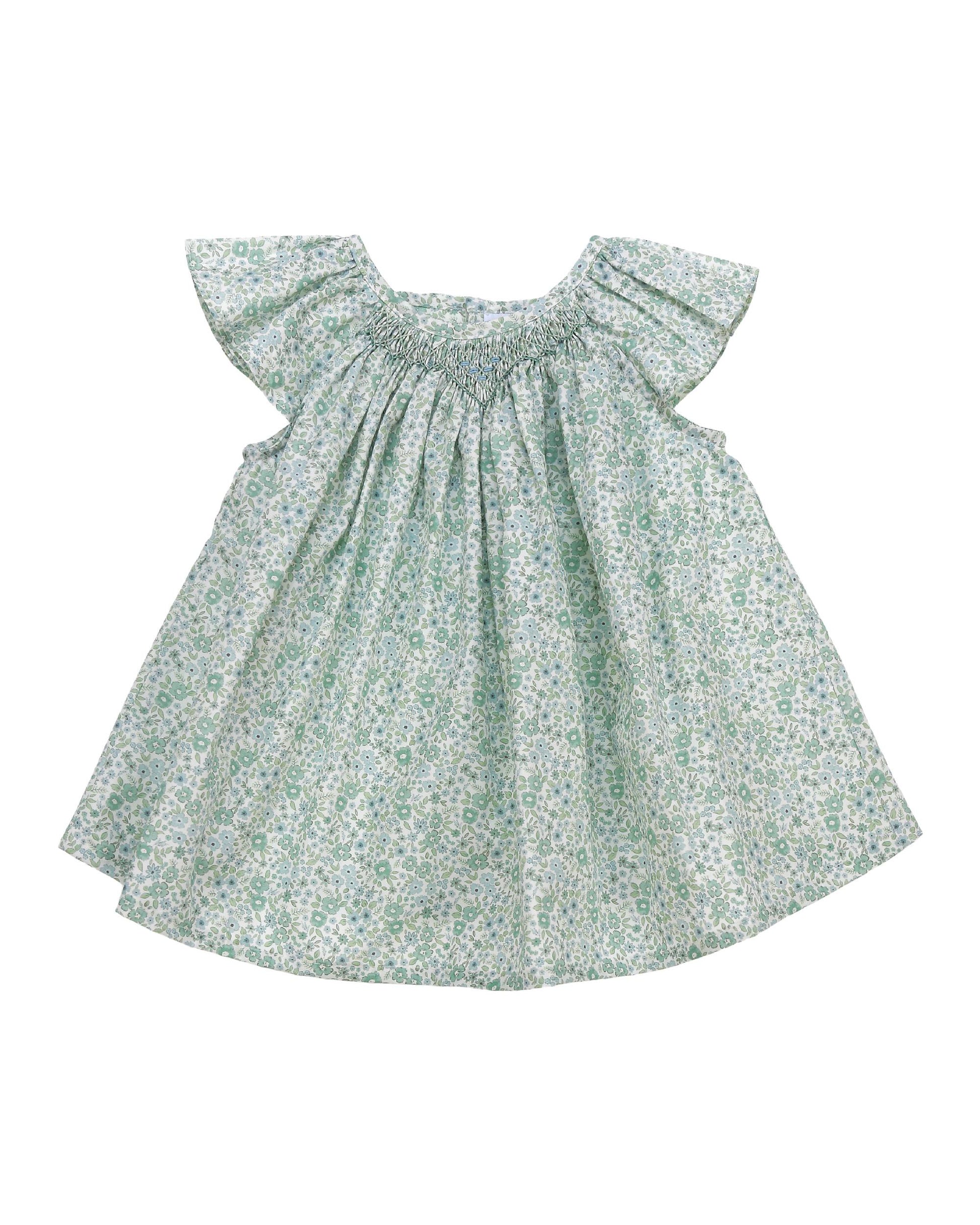 Sage green floral baby girl top with hand smocked neckline and flutter sleeves