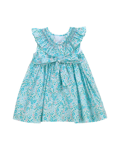 Back view of blue floral smocked dress for toddler with flutter sleeves and gathered skirt