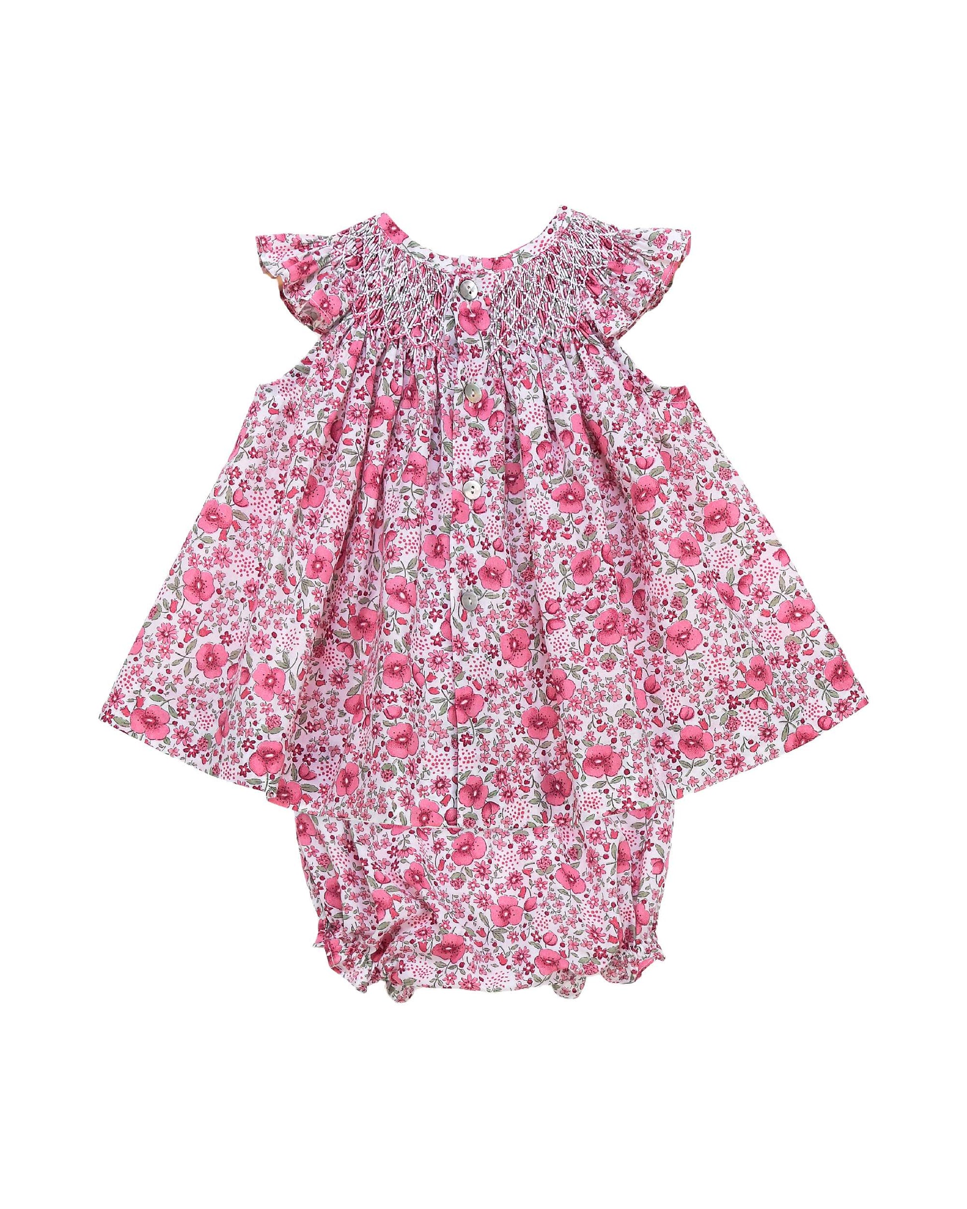 Back view of pink floral baby girl dress set with smocking and flutter sleeves