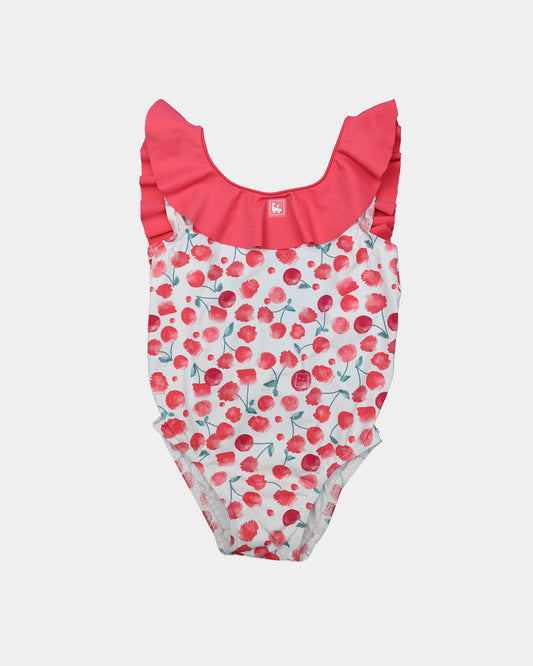 Al Agua Patos girls cherry print swimsuit with red ruffle neckline.