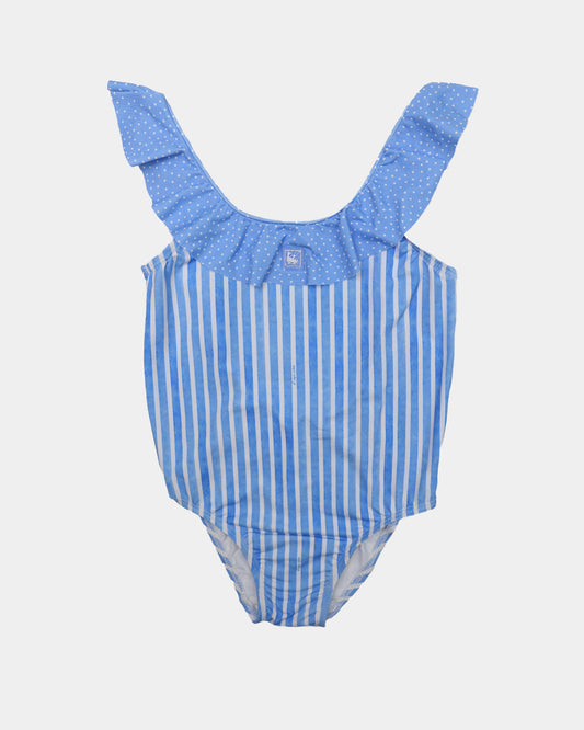 Al Agua Patos girls blue and white striped swimsuit with polka dot ruffle straps.