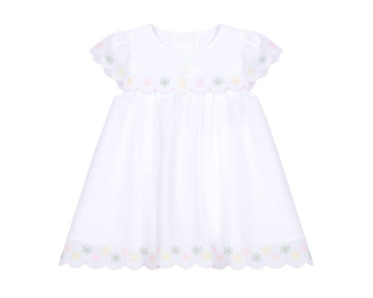 White baby girl dress with pastel floral embroidery, scalloped yoke, flutter sleeves, and scalloped hem.”