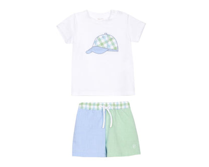 Baby boys white t-shirt with blue and green plaid baseball cap motif paired with blue and green colorblock shorts.